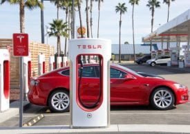 Tesla reports Q2 profit, shares rise