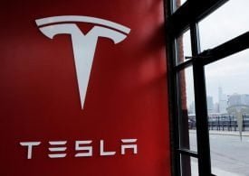 Tesla, Apple up in Premarket After Stock Splits; Philips Slumps