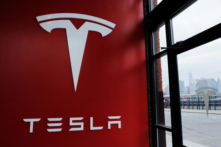 Tesla, Apple up in Premarket After Stock Splits; Philips Slumps