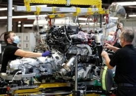 UK factories grow for fourth month, job losses slow