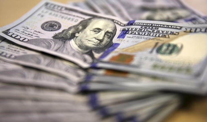 Dollar Edges Lower After Powell's Comments Prompted Gains
